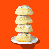A stack of four Hunky Chunky Animal Sugar Cookies with icing and sprinkles