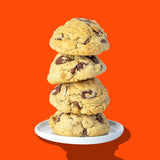 A stack of four Hunky Chunky Chocolate Chip Pancake cookies with jumbo chocolate chips