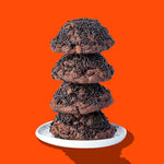 A stack of four Hunky Chunky Chocolate Donut cookies covered in chocolate sprinkles