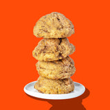 A stack of four Hunky Chunky Cinnamon Roll cookies rolled in cinnamon sugar