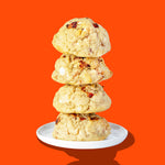 A stack of four Hunky Chunky Strawberry Shortie cookies with freeze-dried strawberries